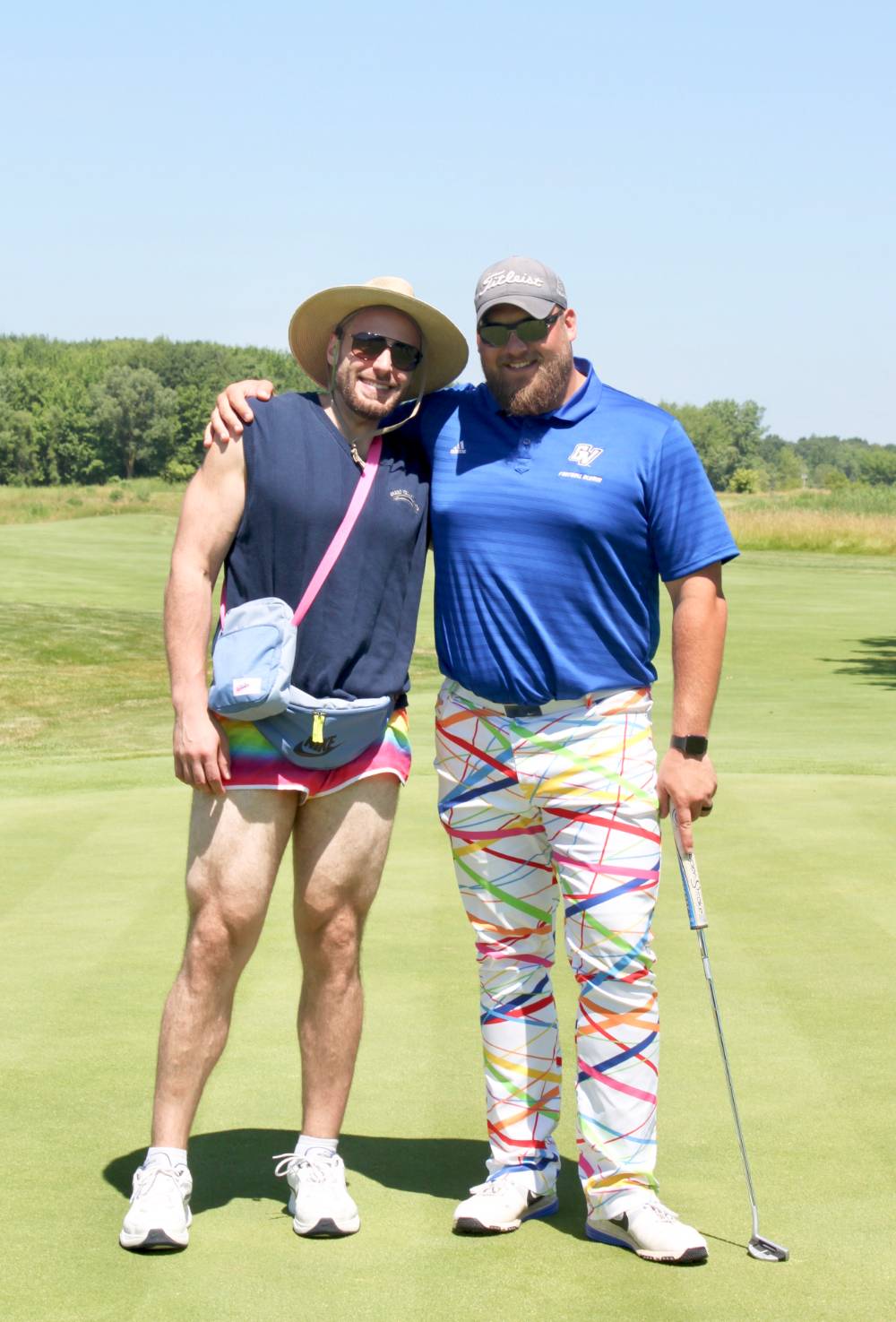 men in funny outfits pose for a photo on the green